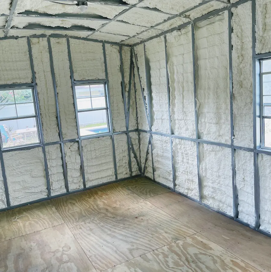 Closed-cell spray foam insulation applied to wall cavities in a residential project in Riverhead